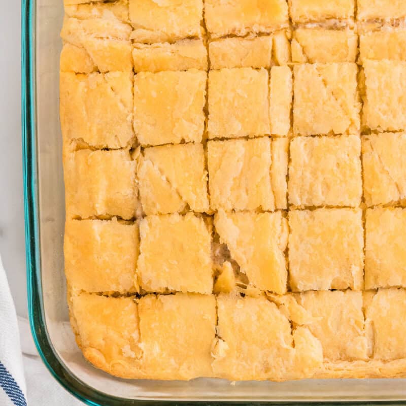 Sausage Cream Cheese Crescent Bake cut into squares in a clear casserole dish