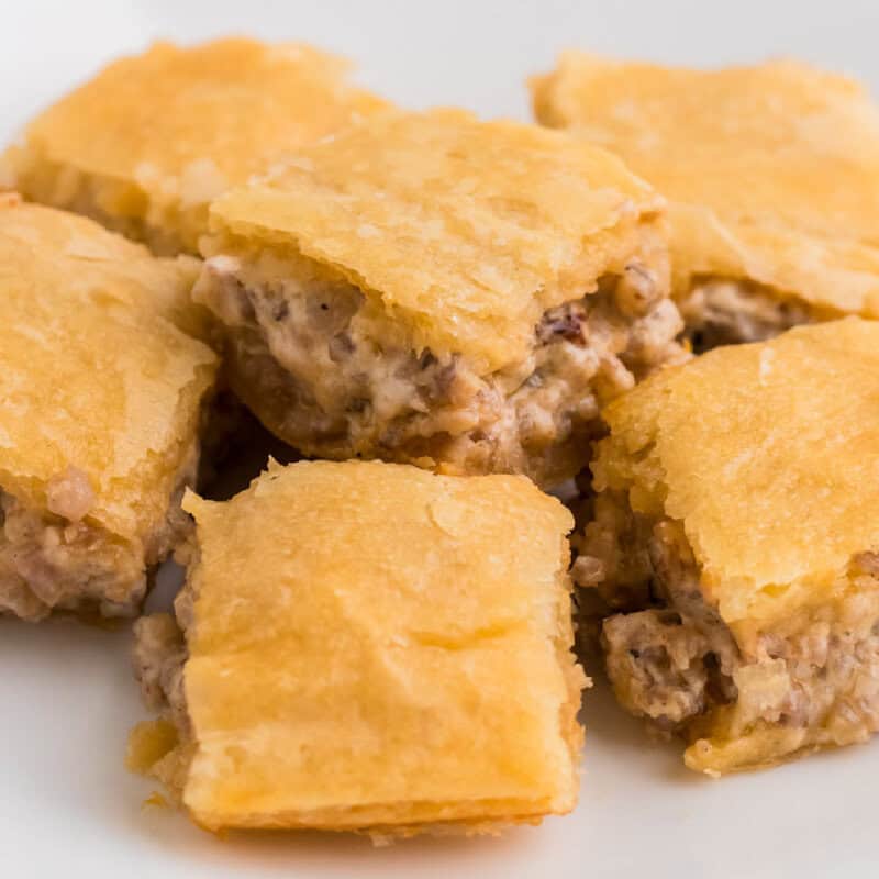 3 Ingredient Sausage Cream Cheese Crescent Bake squares stacked on top of each other