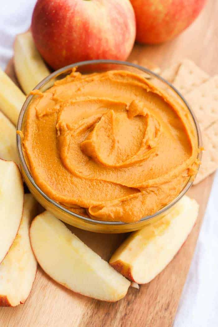 Peanut Butter Pumpkin Pie Dip served in a bowl with apple slices