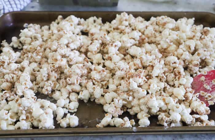 Pumpkin Spice Popcorn on a baking sheet