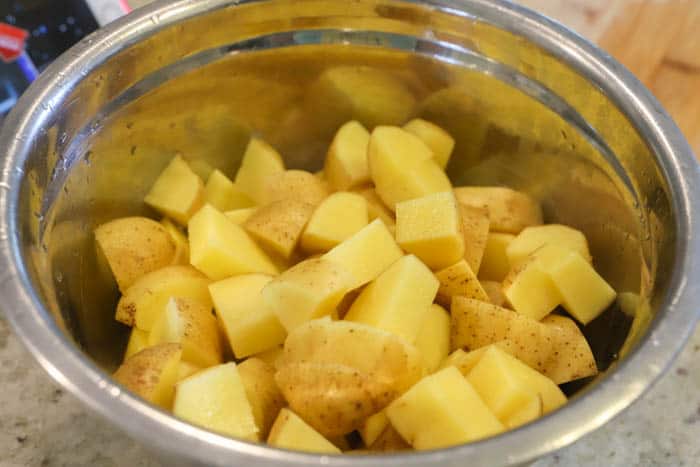 potatoes in a siler mixing bowl