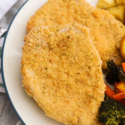 Parmesan Crusted Pork Chops on a white plate