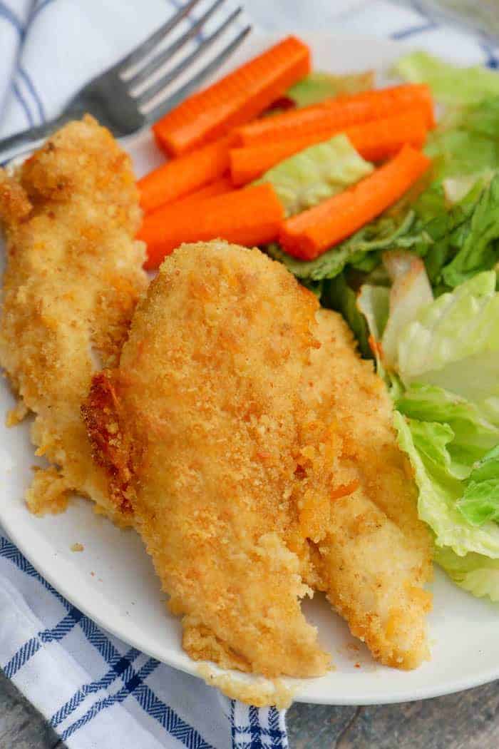 kid friendly dinner Cheesy Ranch Chicken Tenders on a plate with salad