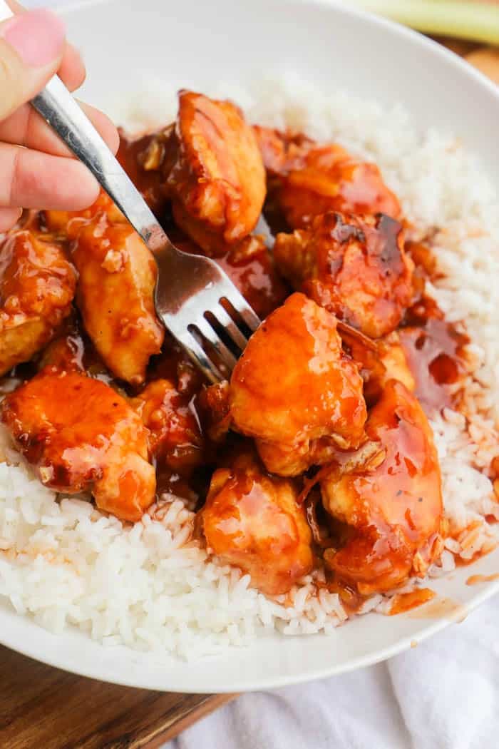 Easy Orange Chicken with a fork