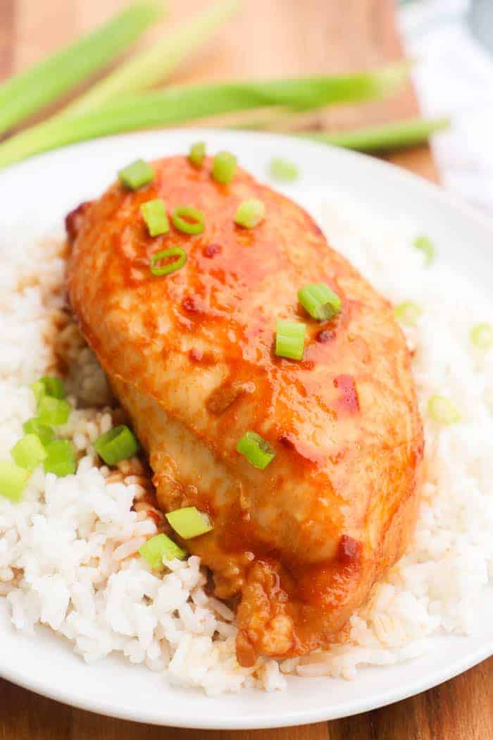 Baked Honey Soy Chicken on top of rice on a plate