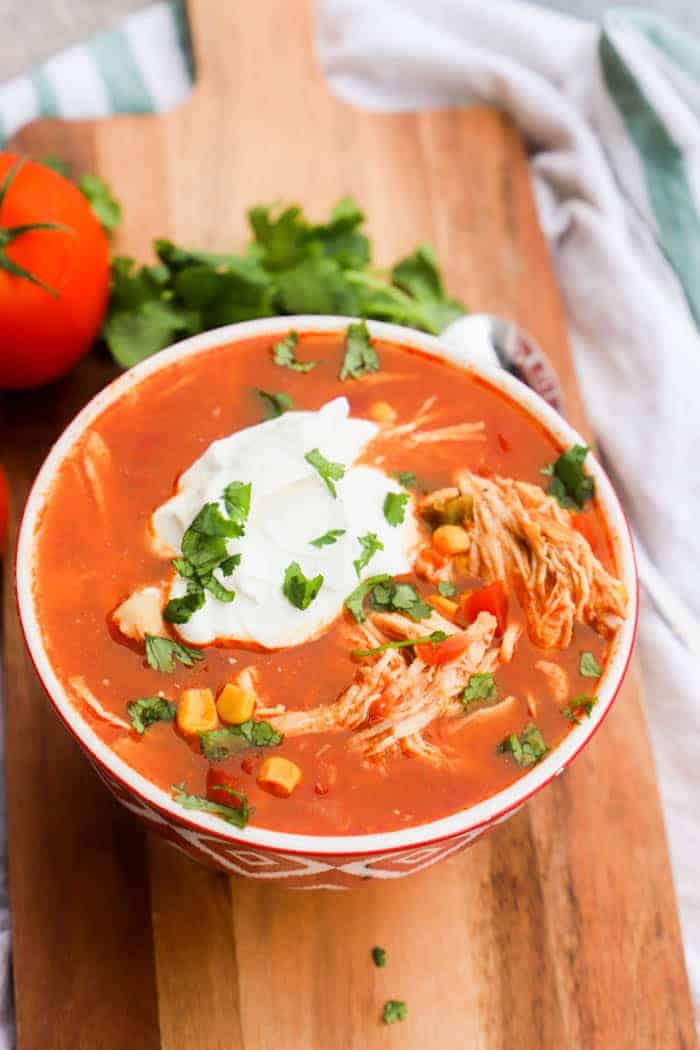 Slow Cooker Chicken Taco Soup in a red bowl