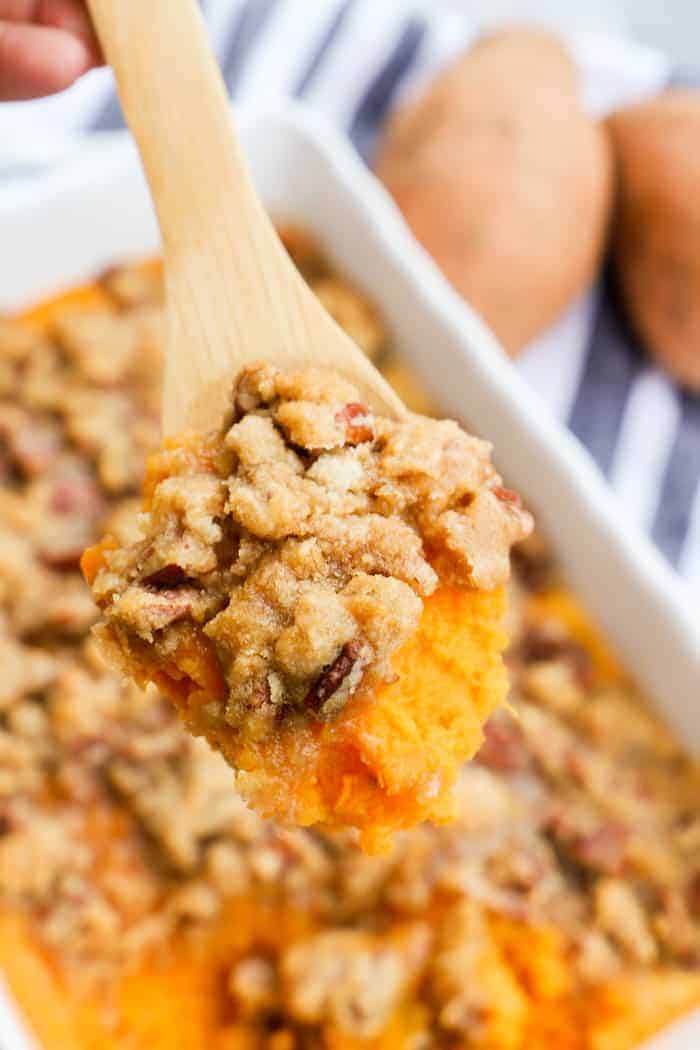 Sweet Potato Casserole in a wooden spoon