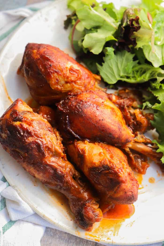 Slow Cooker BBQ Chicken Legs on a white plate