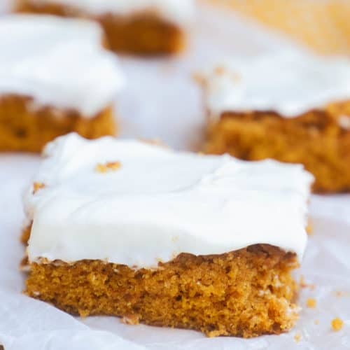 serving Pumpkin Bars on a wooden board