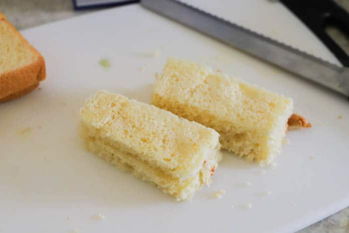 cutting bread for Baked French Toast Sticks