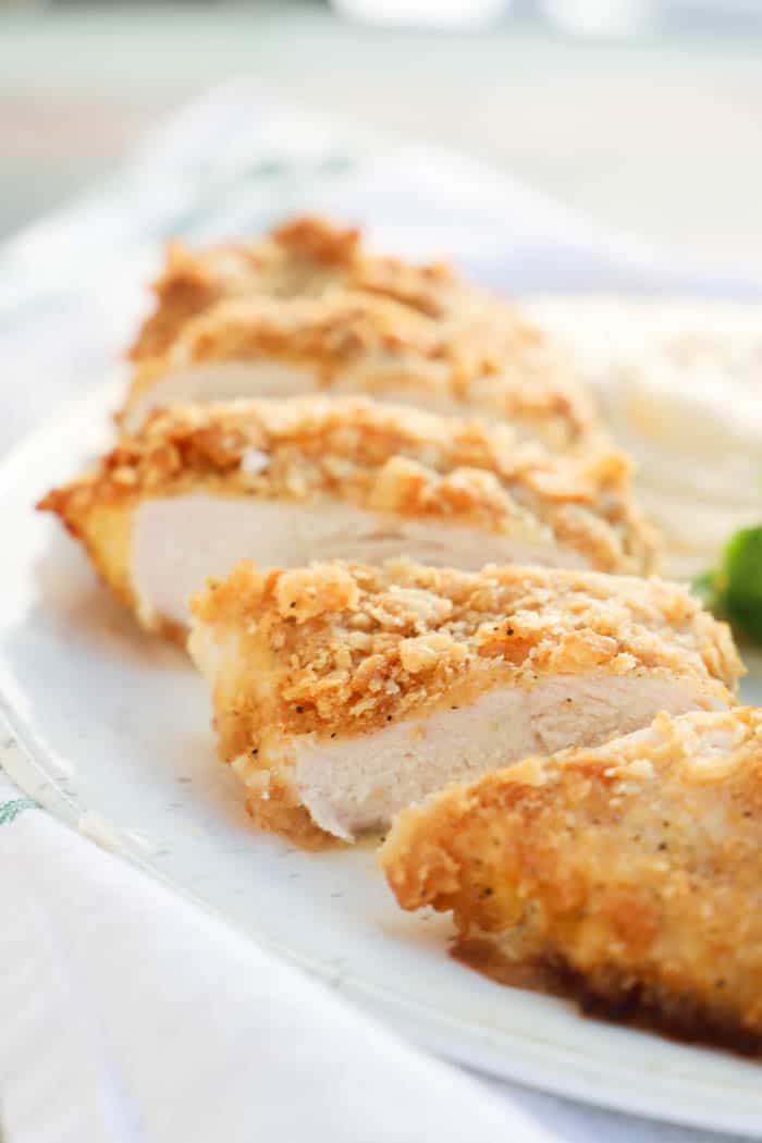 Ritz Chicken sliced on a plate