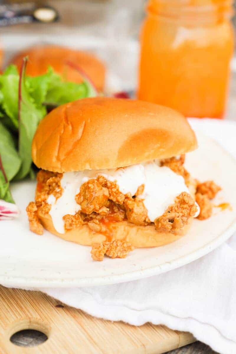 Buffalo Chicken Sloppy Joes on a plate with salad