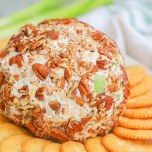 Classic Cheese Ball on a plate with crackers