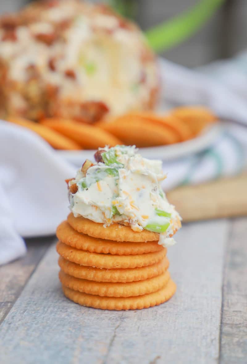Classic Cheese Ball on top of stacked crackers