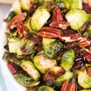 Cranberry Pecan Roasted Brussel Sprouts in a white bowl