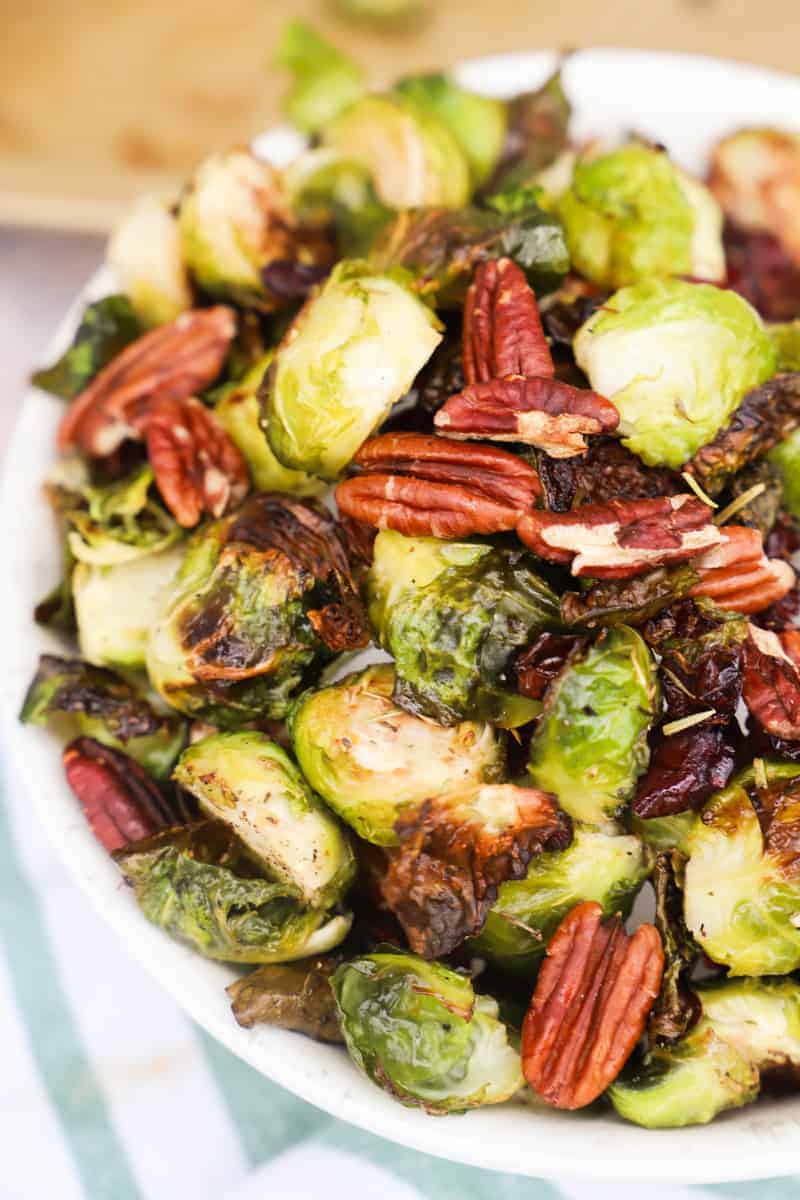 Cranberry Pecan Roasted Brussel Sprouts in a white bowl