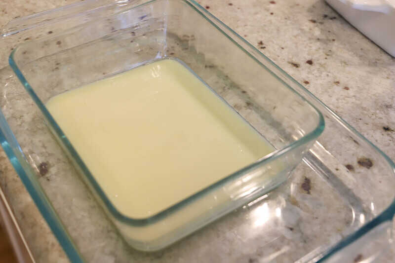 adding milk to the casserole dish 