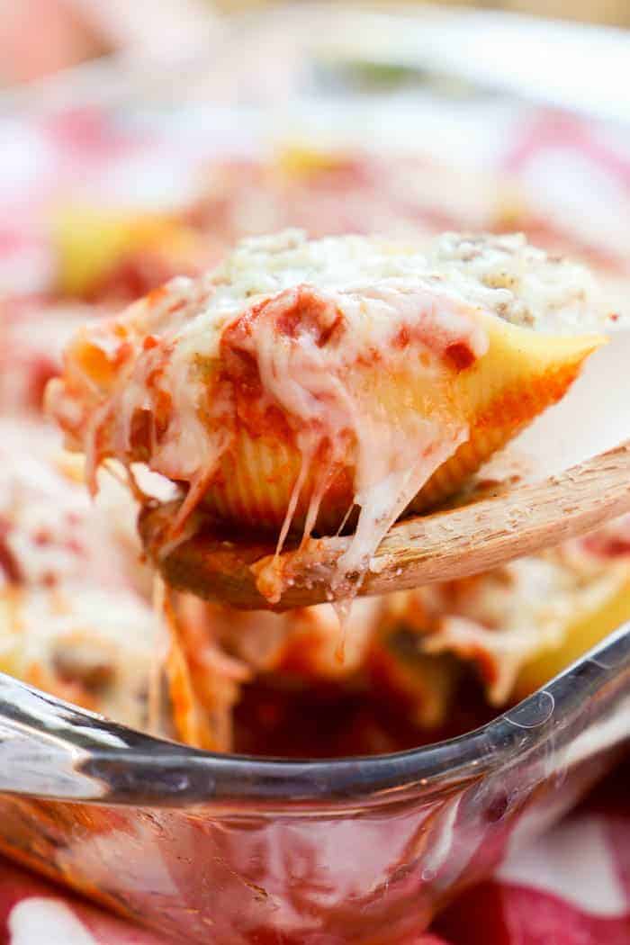 Lasagna Stuffed Shells on a wooden spoon