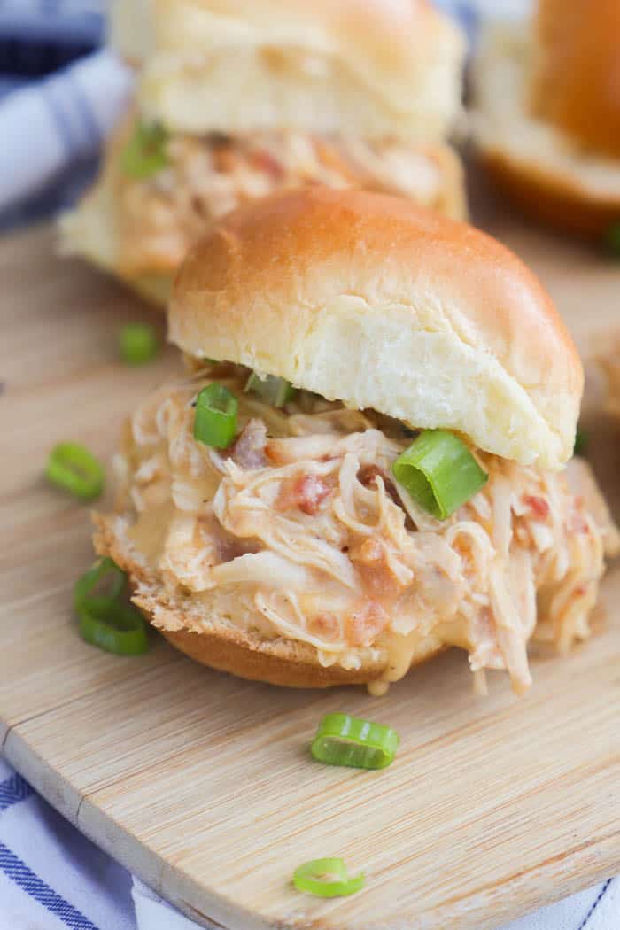 Slow Cooker Chicken Bacon Ranch Sliders on a wooden cutting board