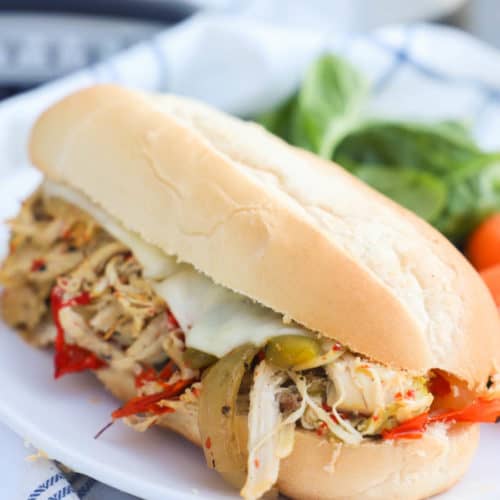 Slow Cooker Philly Chicken Cheesesteak on a plate with salad