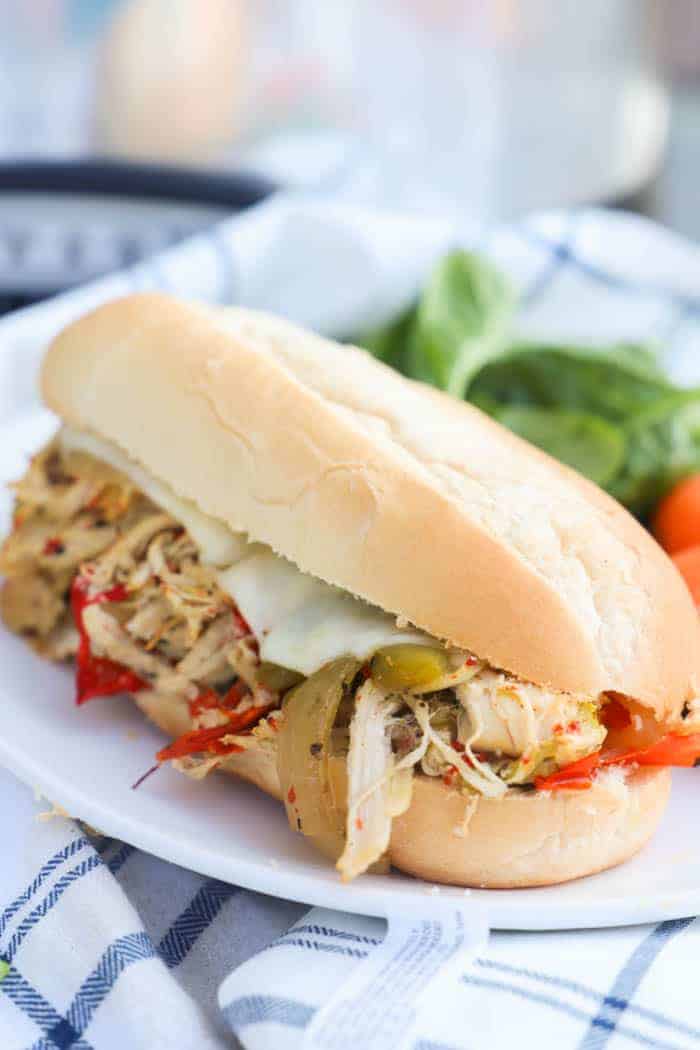 Slow Cooker Philly Chicken Cheesesteak on a plate with salad