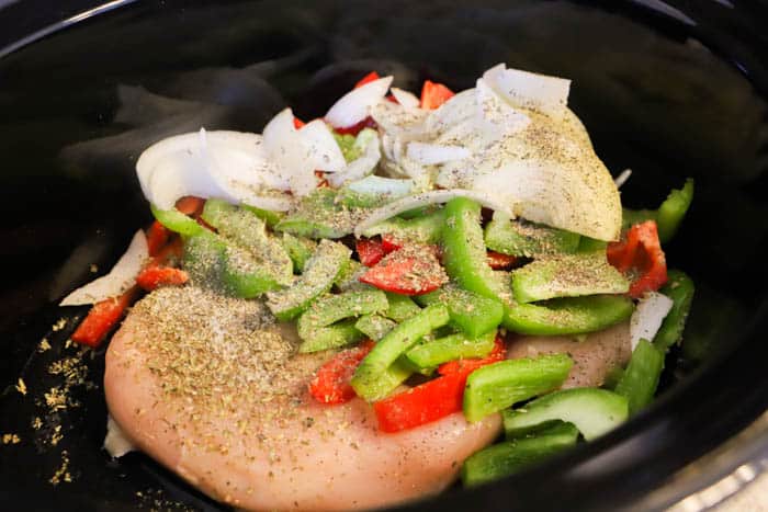 Slow Cooker Philly Chicken Cheesesteak in the slow cooker precooked