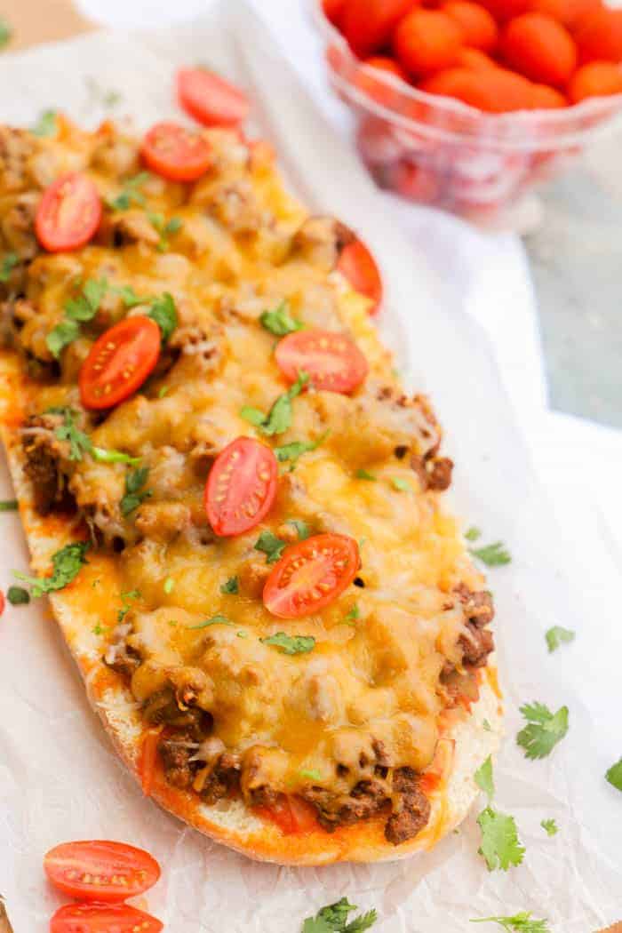 Taco French Bread Pizza on a cutting board