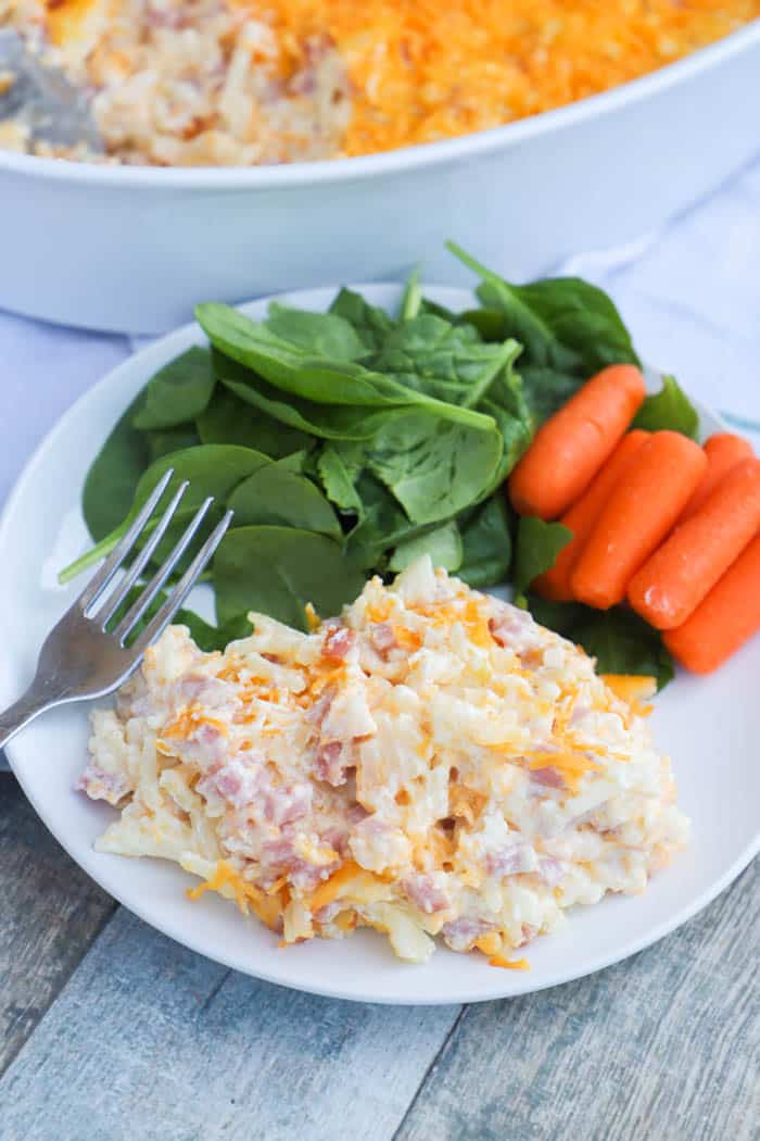 Cheesy Ham and Potato Casserole on a white plate