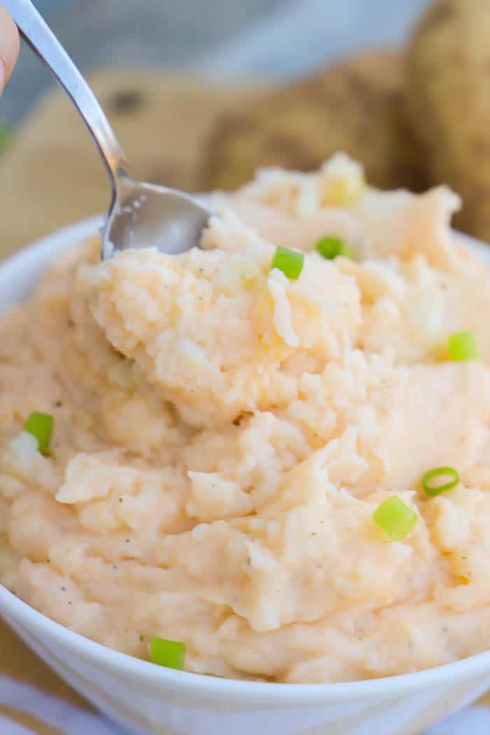 Cheddar Ranch Mashed Potatoes with a bowl and a spoon