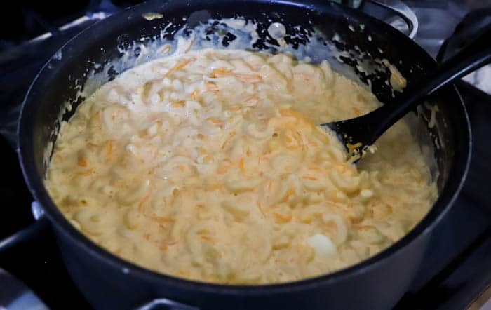 cheese melted over noddles in a large pot