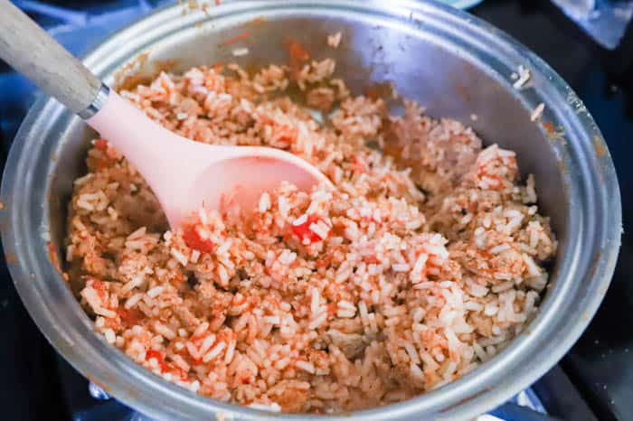 rice and tomatoes in a pot