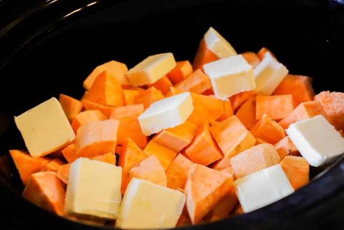 diced potatoes and butter in the slow cooker