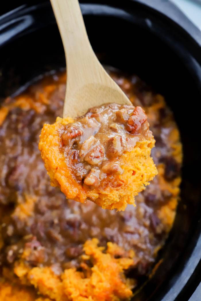 Slow Cooker Sweet Potato Casserole on a wooden spoon