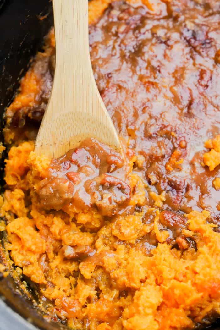 Slow Cooker Sweet Potato Casserole in the slow cooker with a spoon