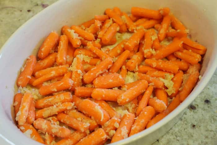 adding butter to carrots