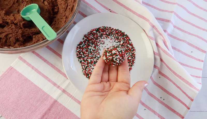 adding sprinkles to a plate