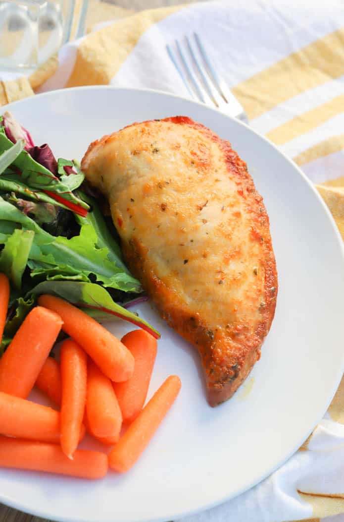 Slow Cooker Italian Chicken on a plate with salad