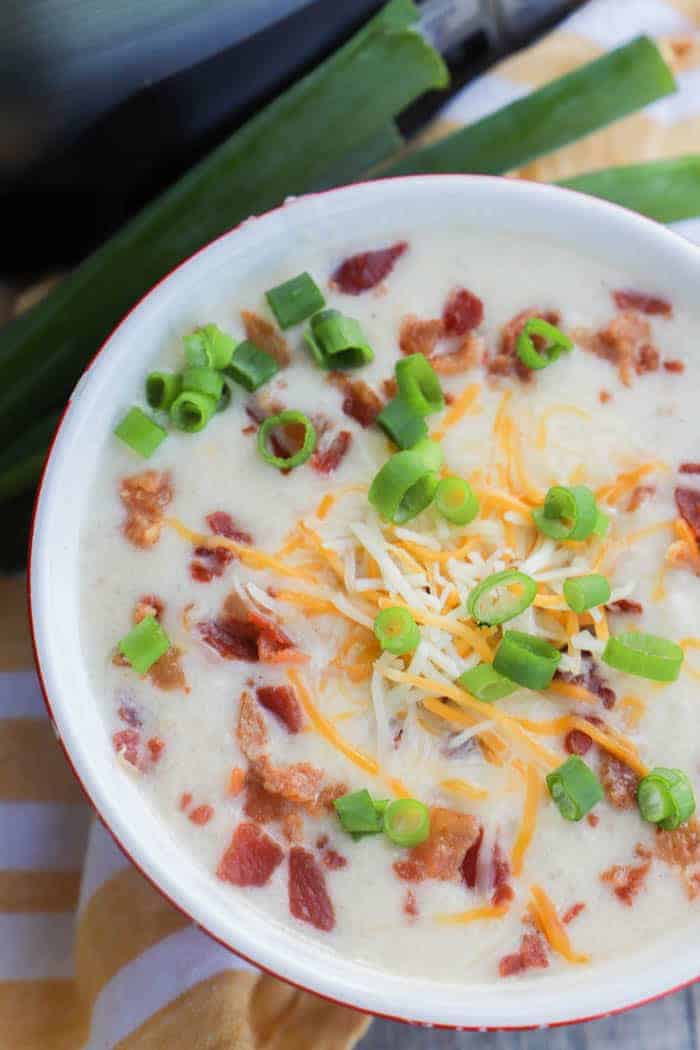 Slow Cooker Loaded Baked Potato Soup in a bowl topped with green onions