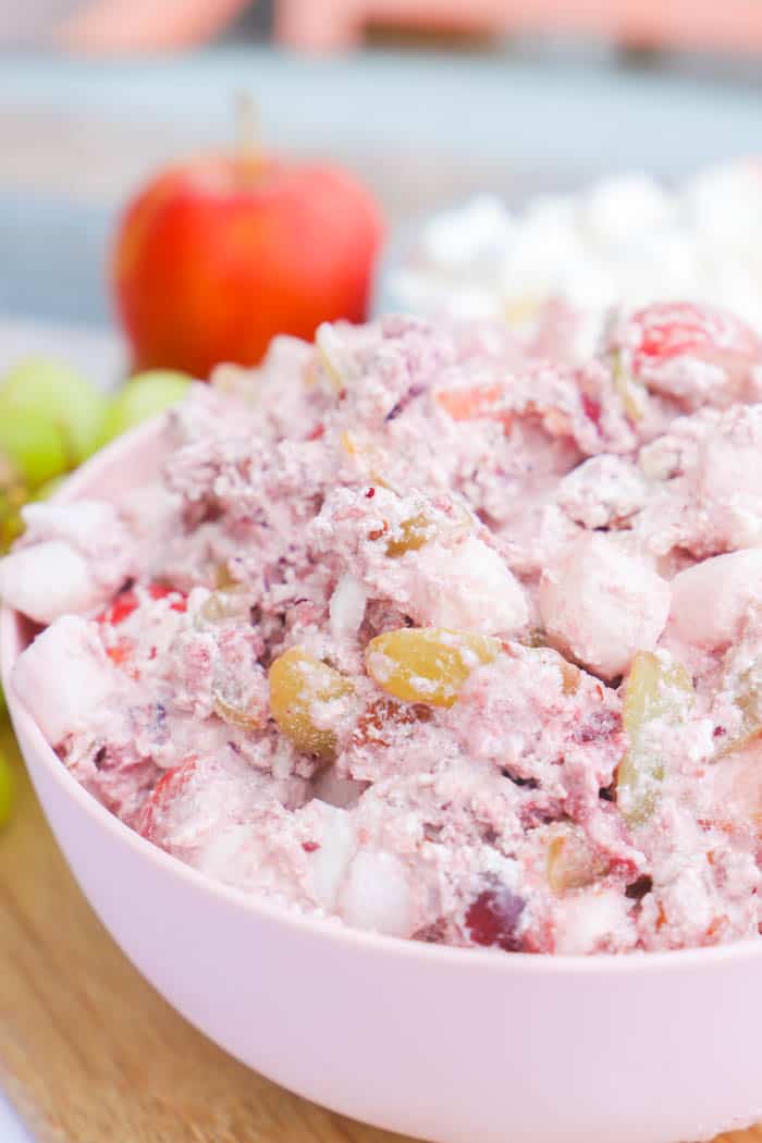 Cranberry Fluff on a cutting board with fruit