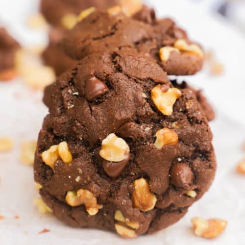 Chocolate Walnut Cookies served on a wooden cutting board