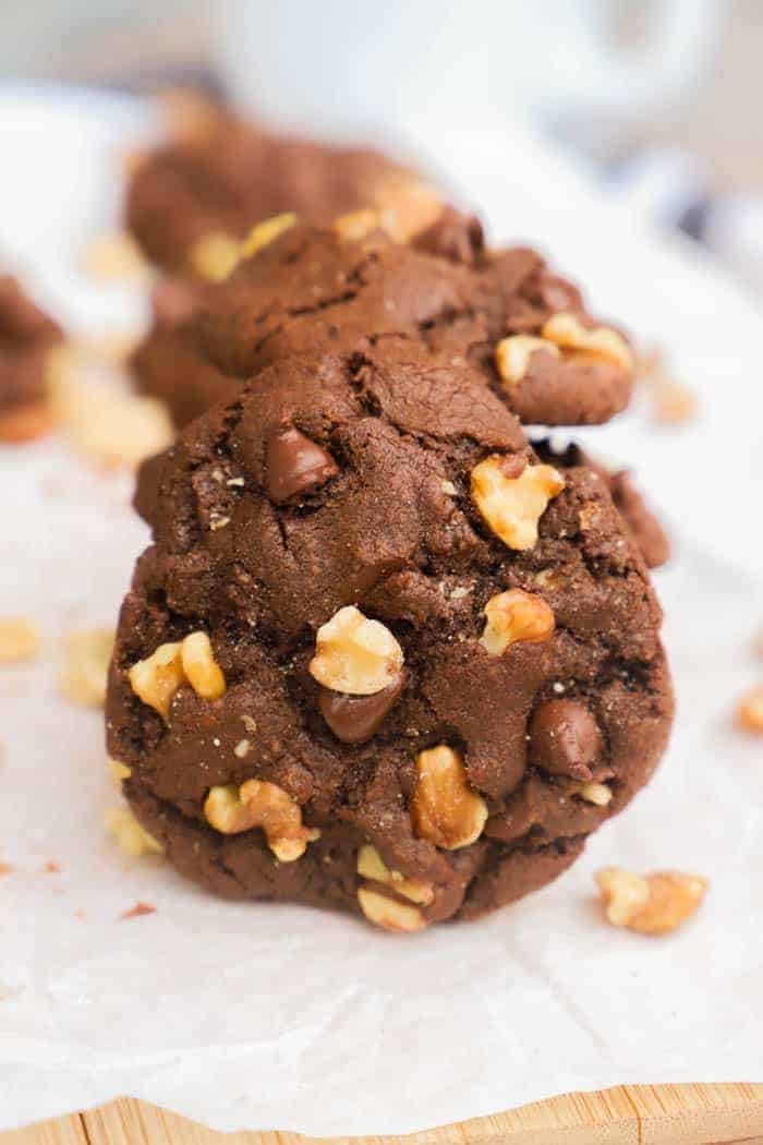 Chocolate Walnut Cookies served on a wooden cutting board