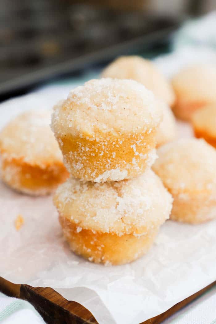 Sugar Donut Mini Muffins stacking on top of each other