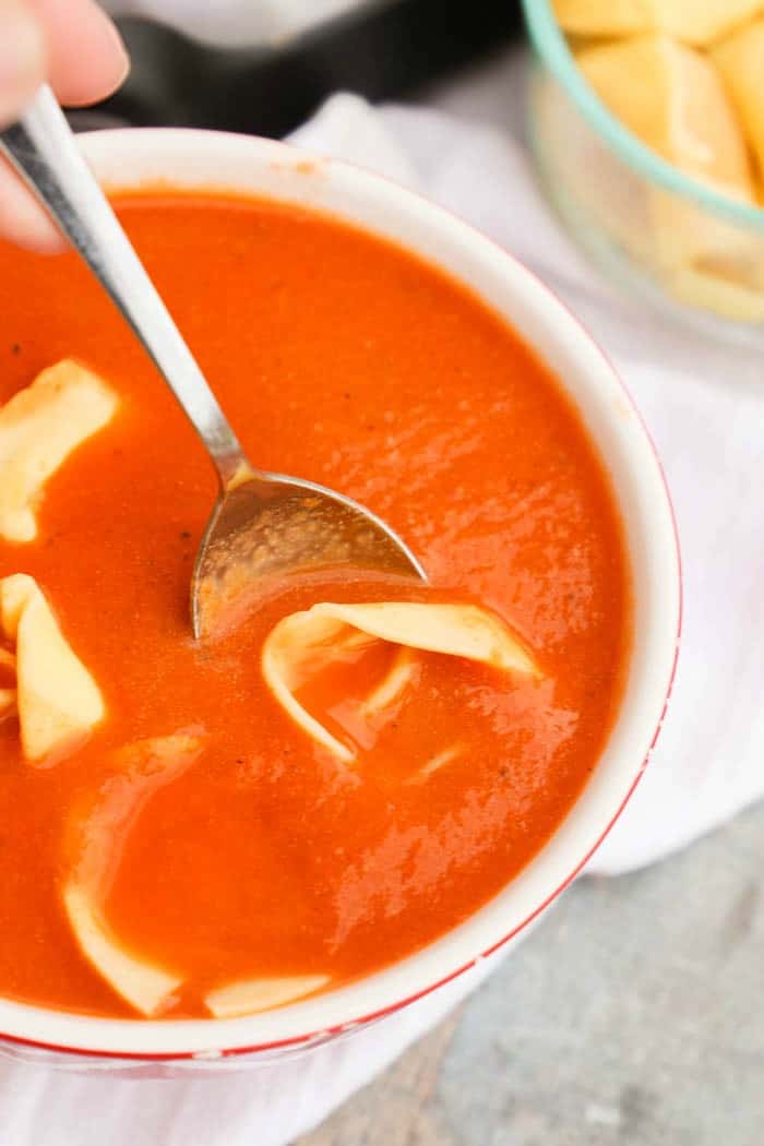 Slow Cooker Tomato Soup and Tortellini on a spoon
