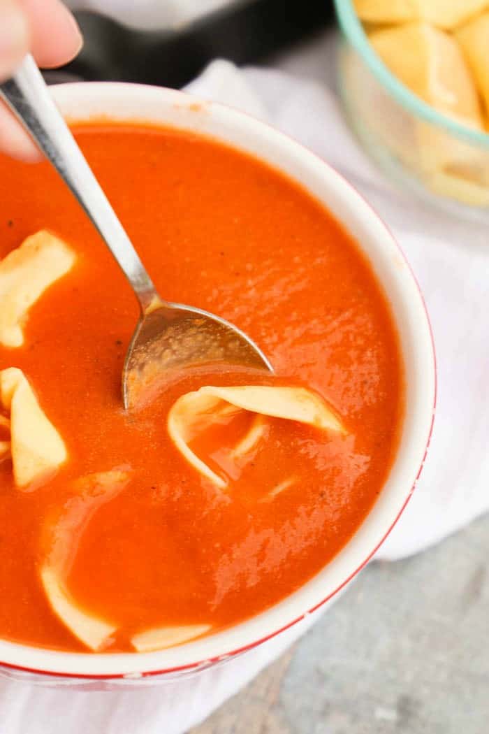 Slow Cooker Tomato Soup and Tortellini on a spoon