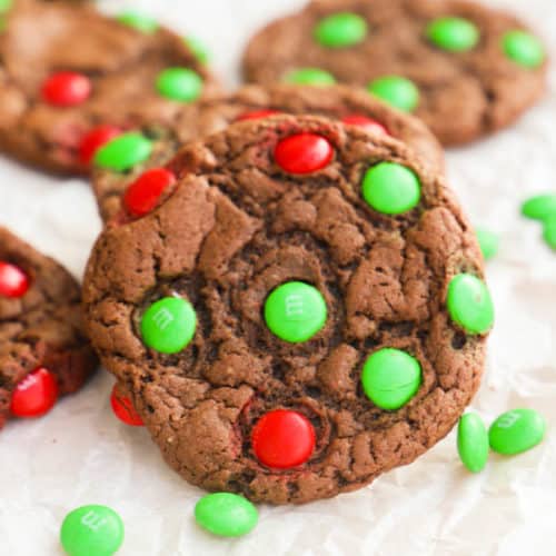 Chocolate Cake Mix Christmas Cookies on a cutting board with m&Ms