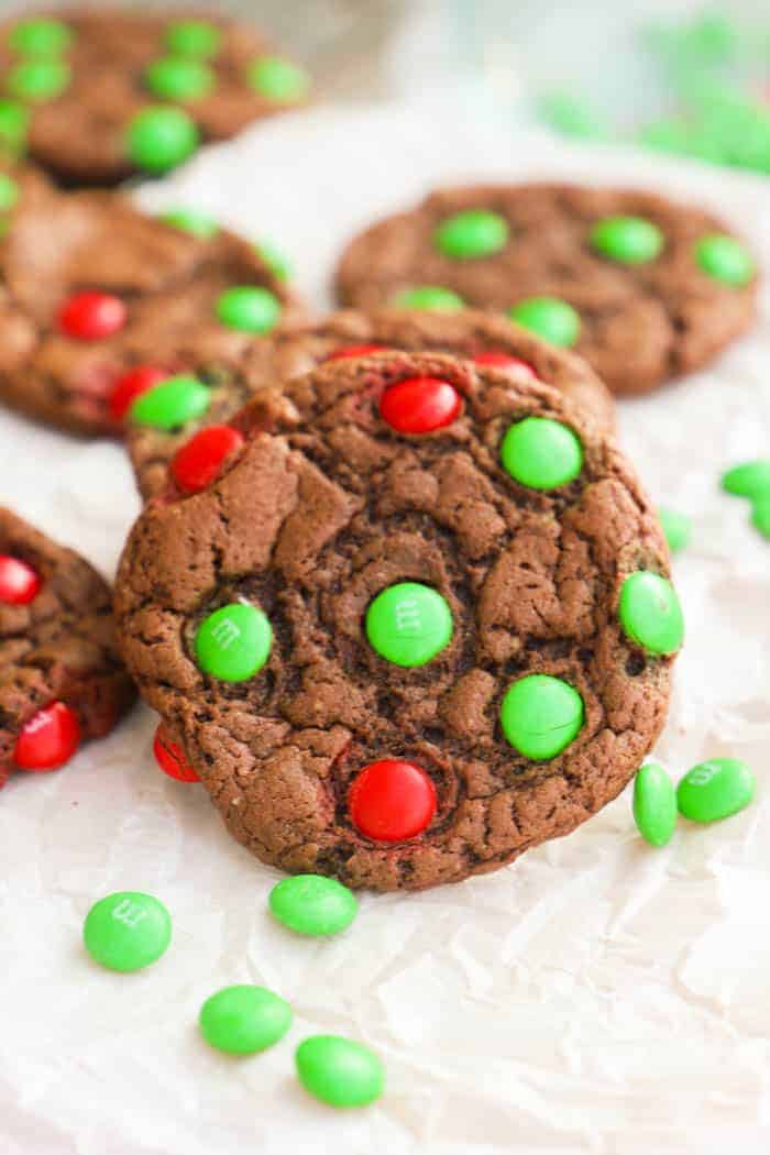 Chocolate Cake Mix Christmas Cookies on a cutting board with m&amp;Ms