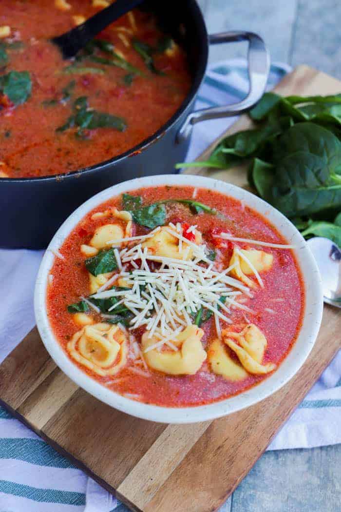 Creamy Tomato Tortellini Soup Recipe in a white bowl
