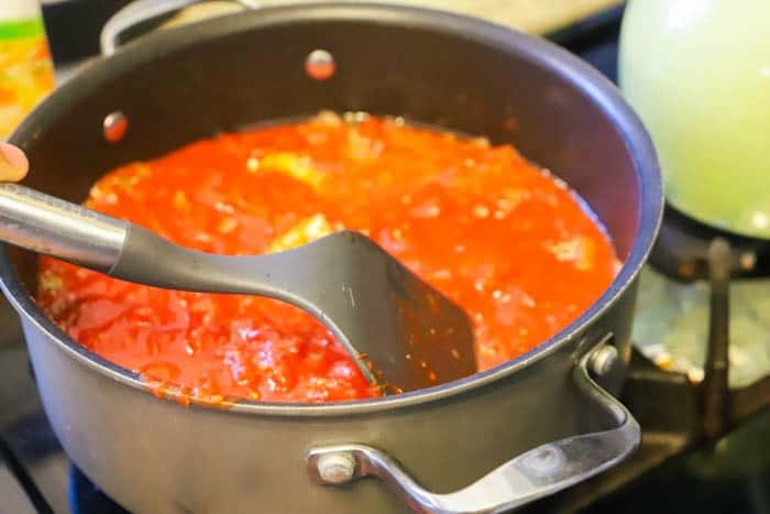 making Creamy Tomato Tortellini Soup Recipe in a large pot