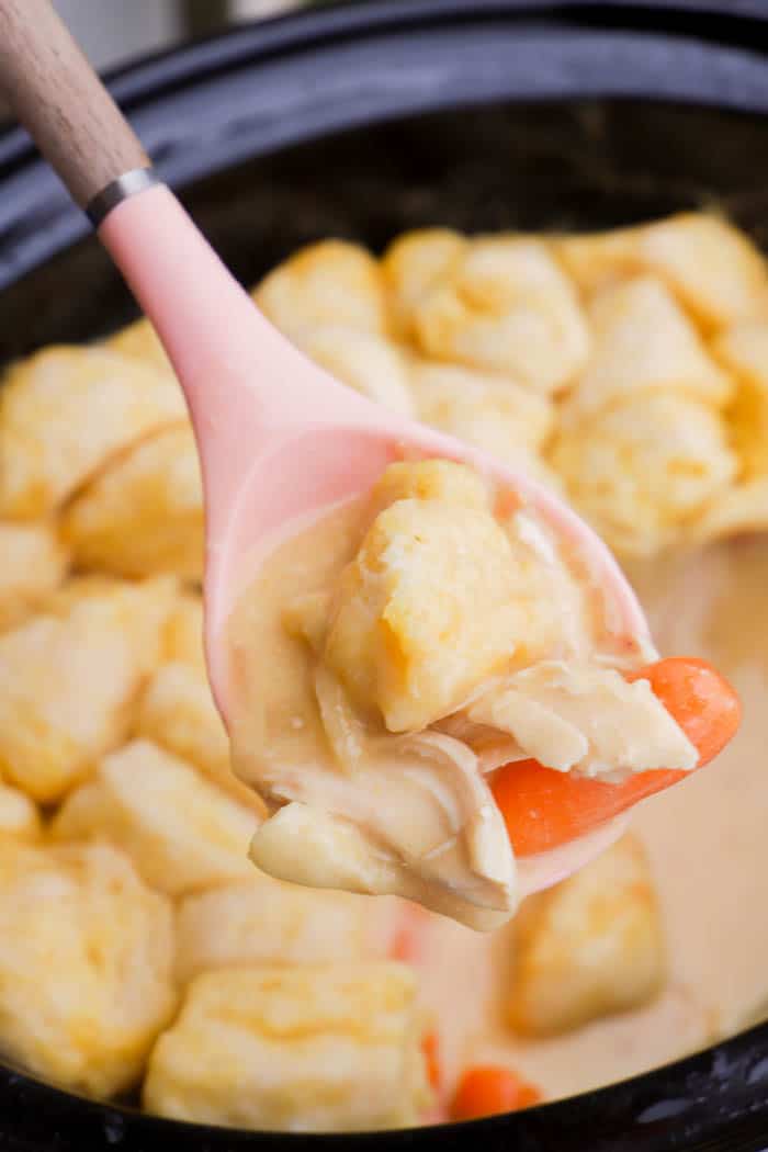 Slow Cooker Chicken and Dumplings on a pink spoon