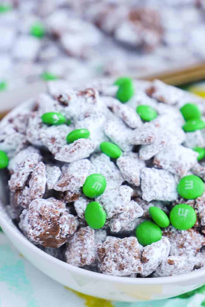 Mint Chocolate Puppy Chow in a bowl with green M&Ms